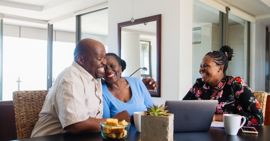 older couple and daughter crafting a will