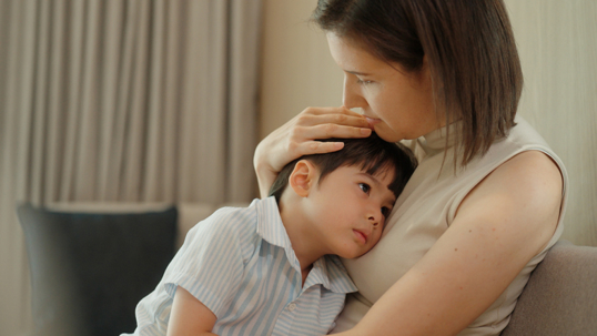 mother comforting son